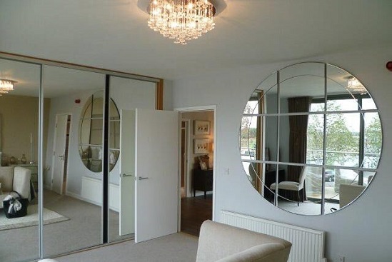 internal of shipping container home showing mirrored wardrobe.